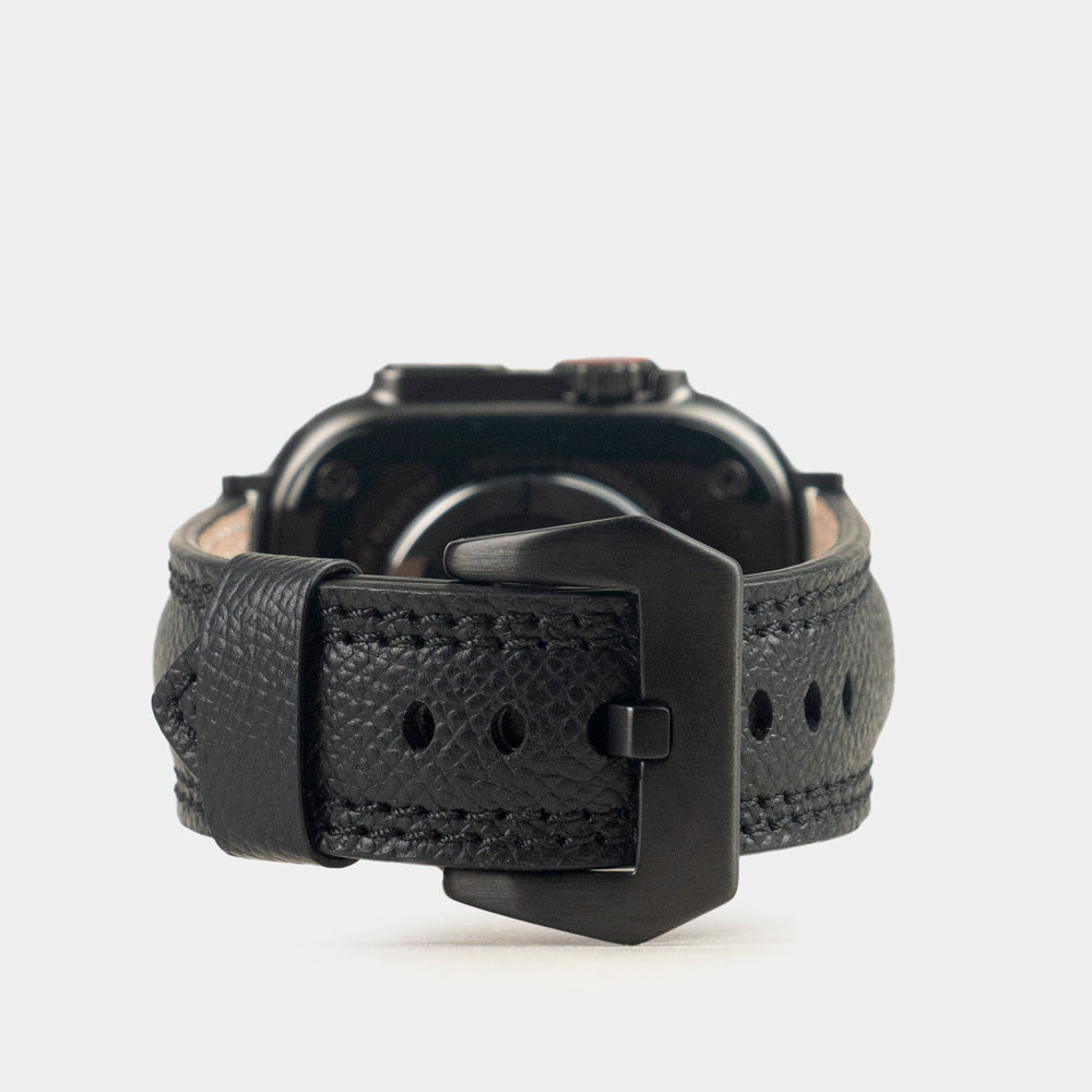 Apple Watch Ultra bandje heren 49 mm zwart Epsom leer met zwarte gespen — achteraanzicht op de zwarte kast, zwarte pingesp en verstelgaatjes