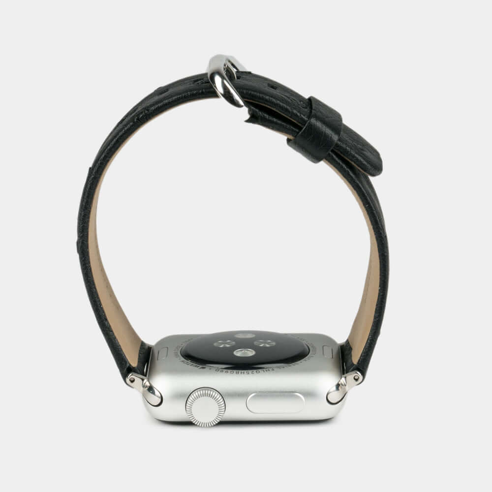 black ostrich strap apple watch with steel adapters and buckle profile view