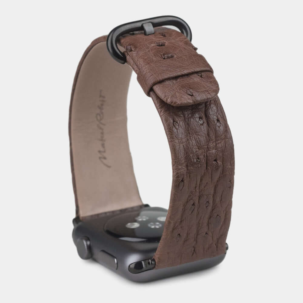 brown ostrich strap apple watch with black adapters & buckle upper view