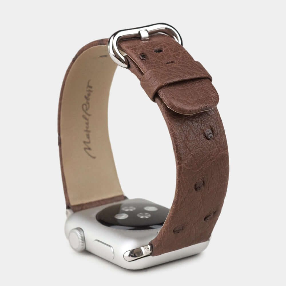 brown ostrich strap apple watch with steel adapters and buckle upper view