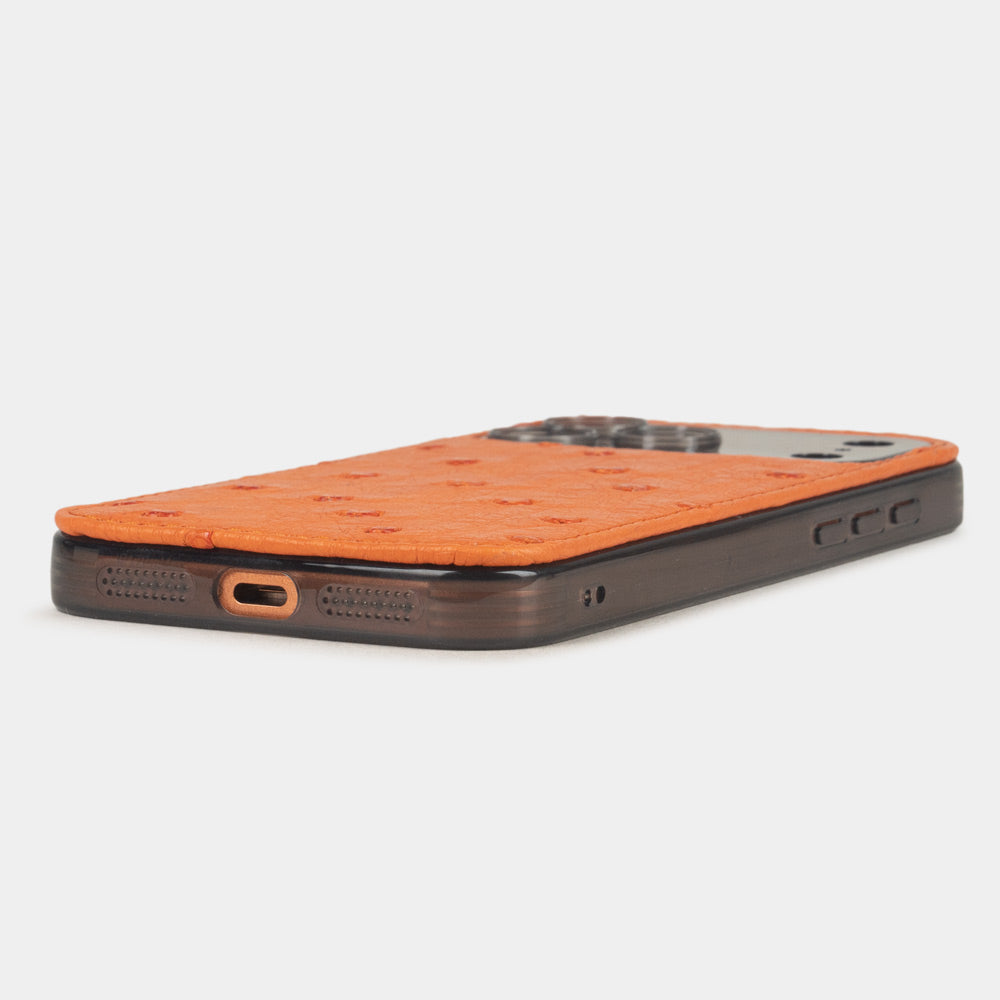 iPhone 17 Pro & Pro Max cover case in orange ostrich leather – flat side view showing the slim profile, USB-C port opening and precise edge finishing
