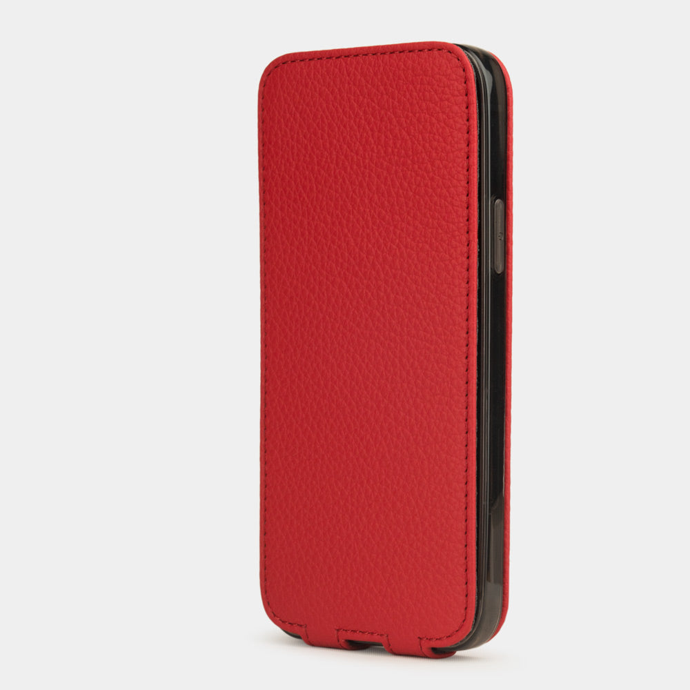 red leather iPhone 12 pro flip case in an upright position, cover closes securely thanks to its integrated magnet system