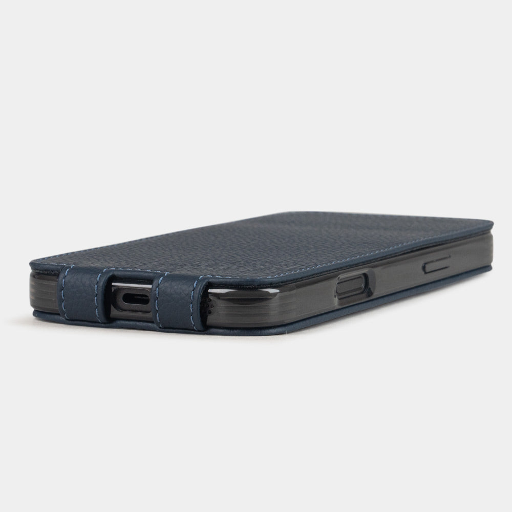 blue leather flip case iPhone 17 - flat side view displaying ultra-thin handcrafted design, USB-C port opening and precise edge finishing