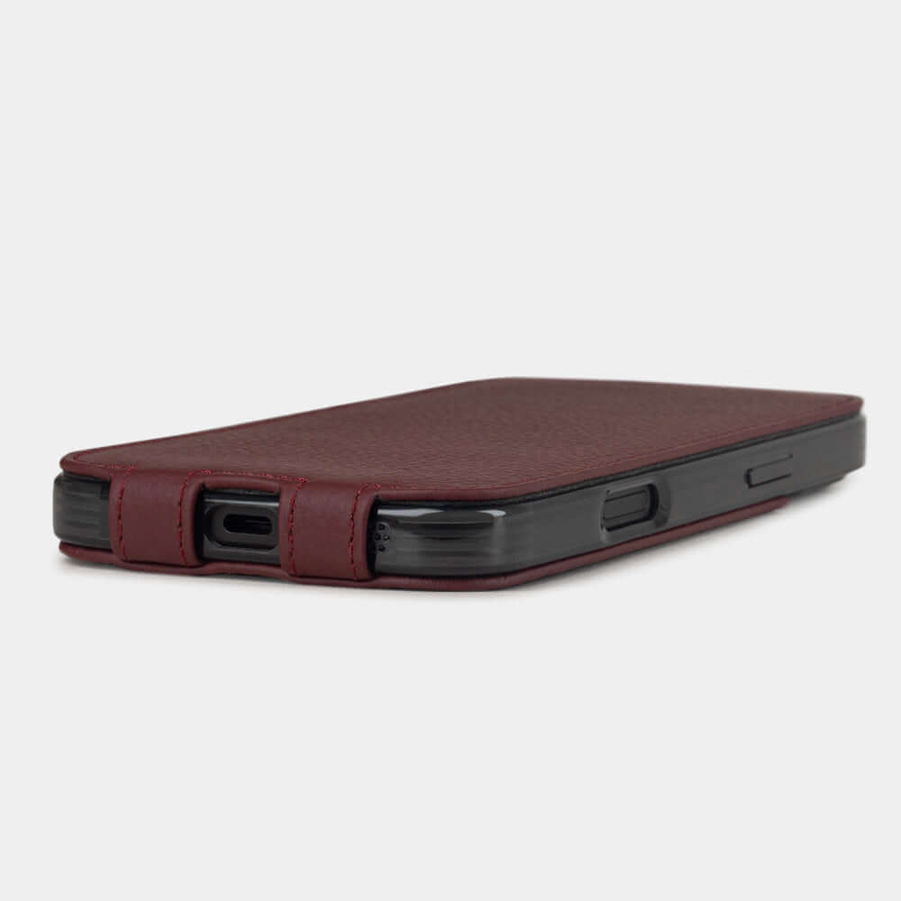 Bordeaux Calfskin Case iPhone 17 - flat side view displaying ultra-thin handcrafted design, USB-C port opening and precise edge finishing