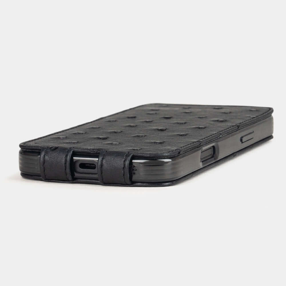 Black Ostrich Case iPhone 17 - flat side view displaying ultra-thin handcrafted design, USB-C port opening and precise edge finishing