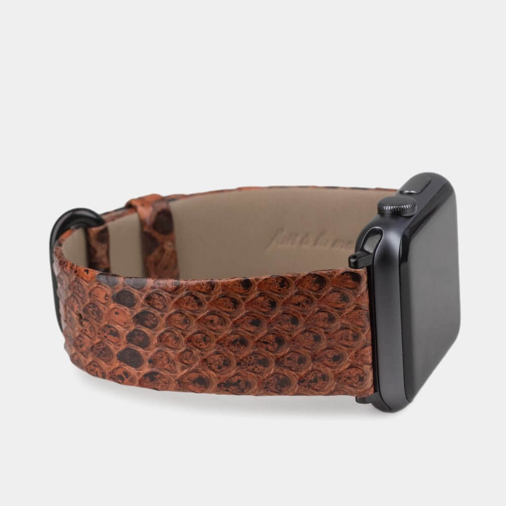 gold python strap apple watch with black adapters and buckle side view