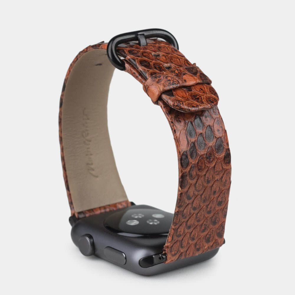gold python strap apple watch with black adapters and buckle upper view
