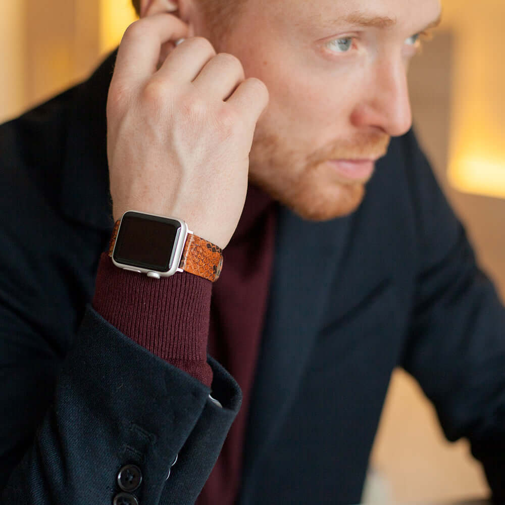 gold python strap apple watch with steel adapters and buckle contextual image