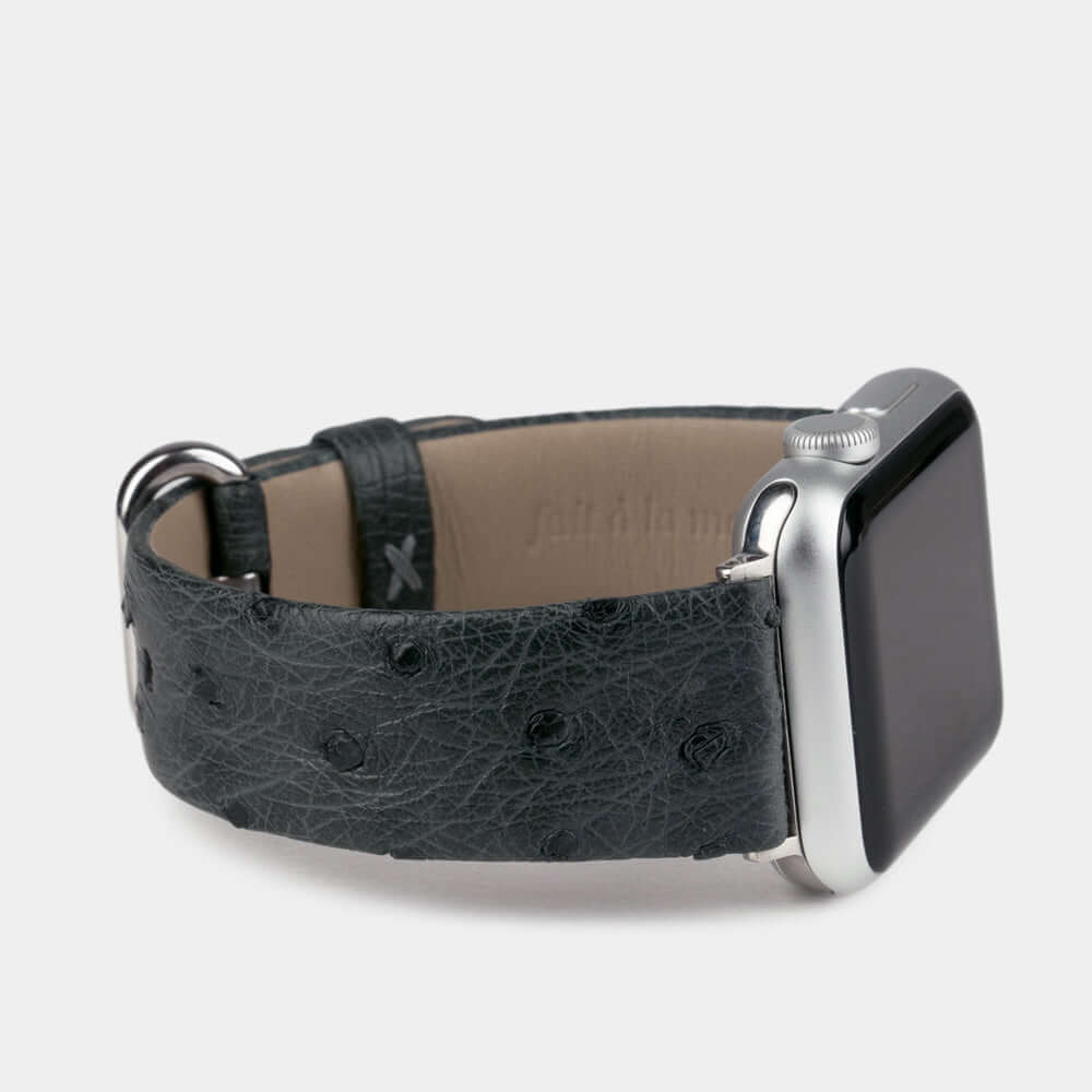 grey ostrich strap apple watch with steel adapters and buckle side view