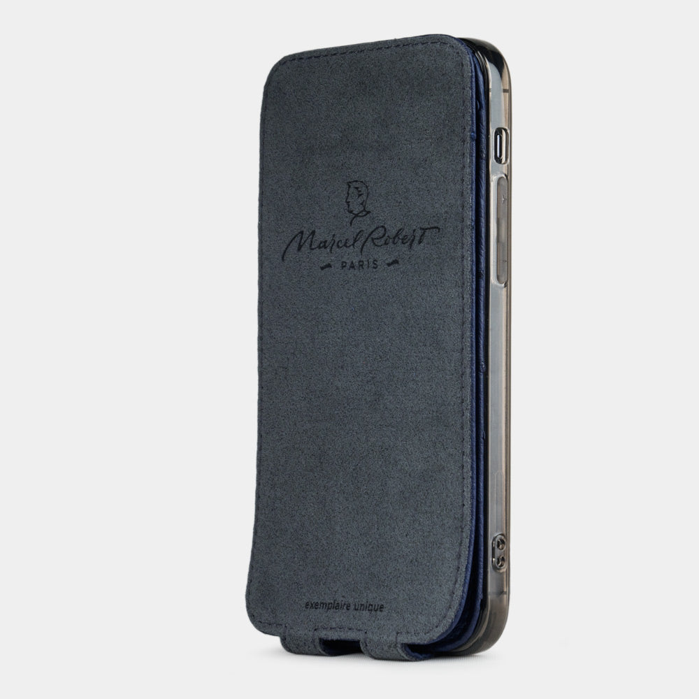 blue ostrich leather flip case for iPhone 12 pro max, vertical position, cover folded and secured to the back of the iPhone thanks to its integrated magnet system, revealing the grey microfibre lining