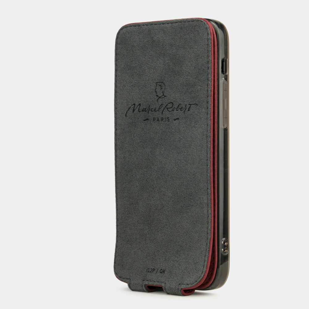 cherry leather flip case for iPhone 12 Pro Max, vertical position, cover folded and secured to the back of the iPhone thanks to its integrated magnet system, revealing the grey microfiber lining