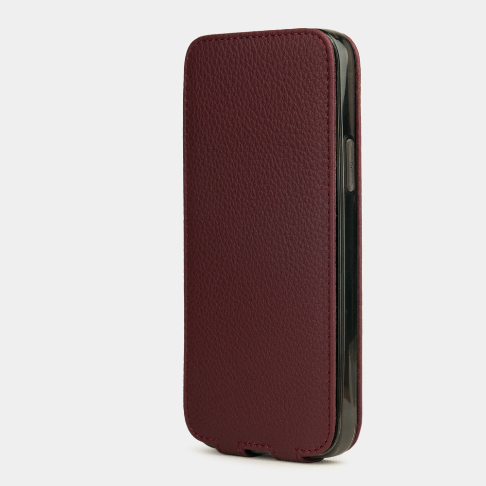 bordeaux leather iPhone 12 Pro flip case in an upright position, cover closes securely thanks to its integrated magnet system