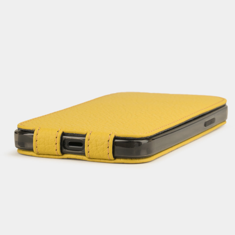 yellow leather flip case for iPhone 12 pro, view of the case laid flat showing its slim profile