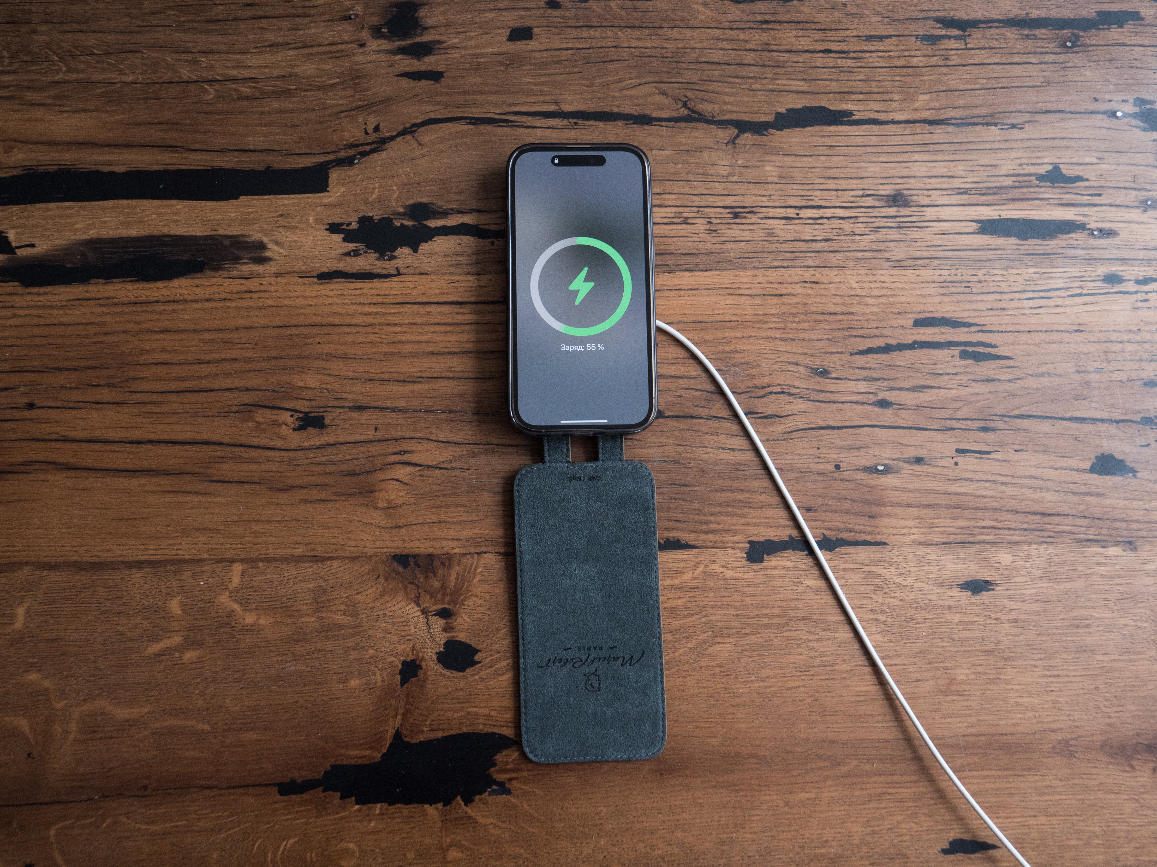 iPhone 13 Pro wireless MagSafe charging with Marcel Robert green ostrich leather case Alcantara lining visible