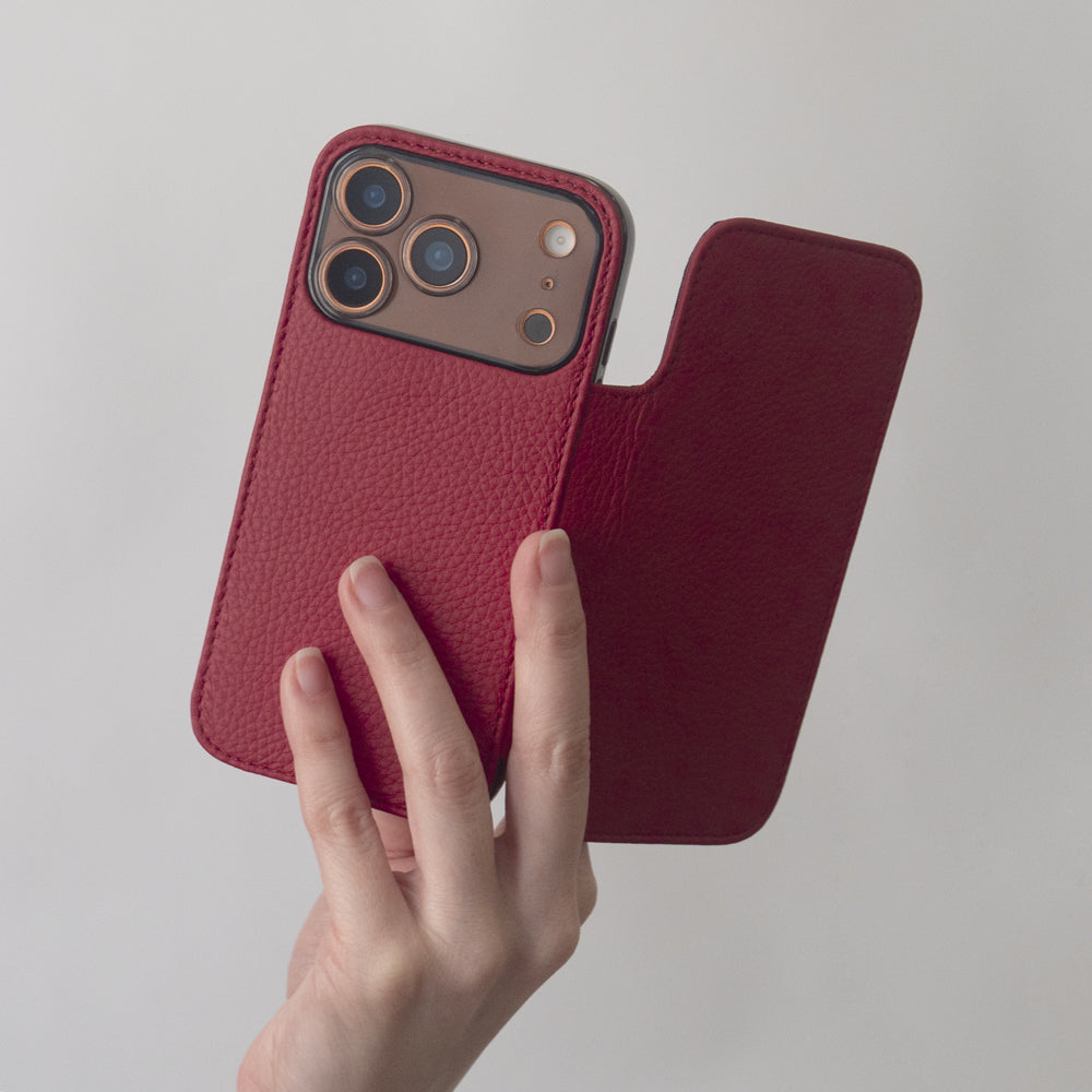 iPhone 17 Pro Marcel Robert red calfskin folio wallet case hold in the hand open showing magnetic flap and camera cutouts