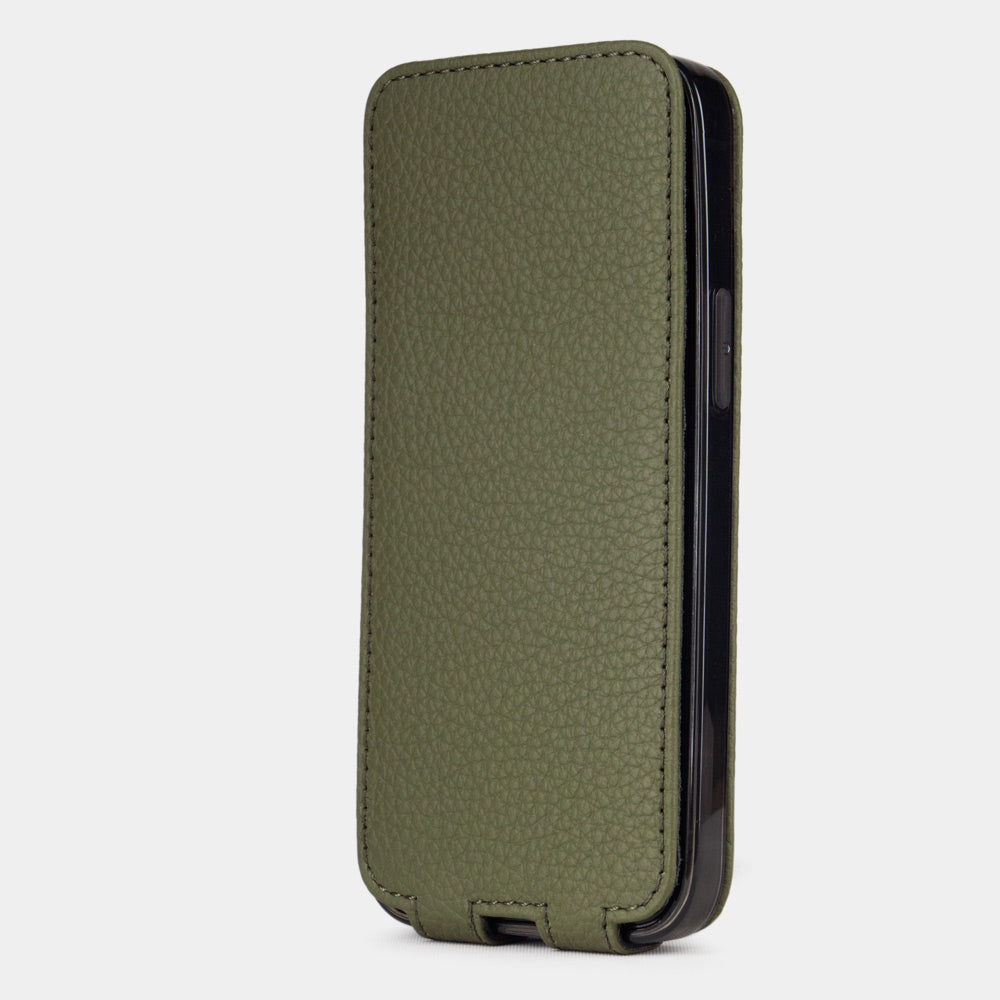 green leather iPhone 12 pro max flip case in an upright position, cover closes securely thanks to its integrated magnet system