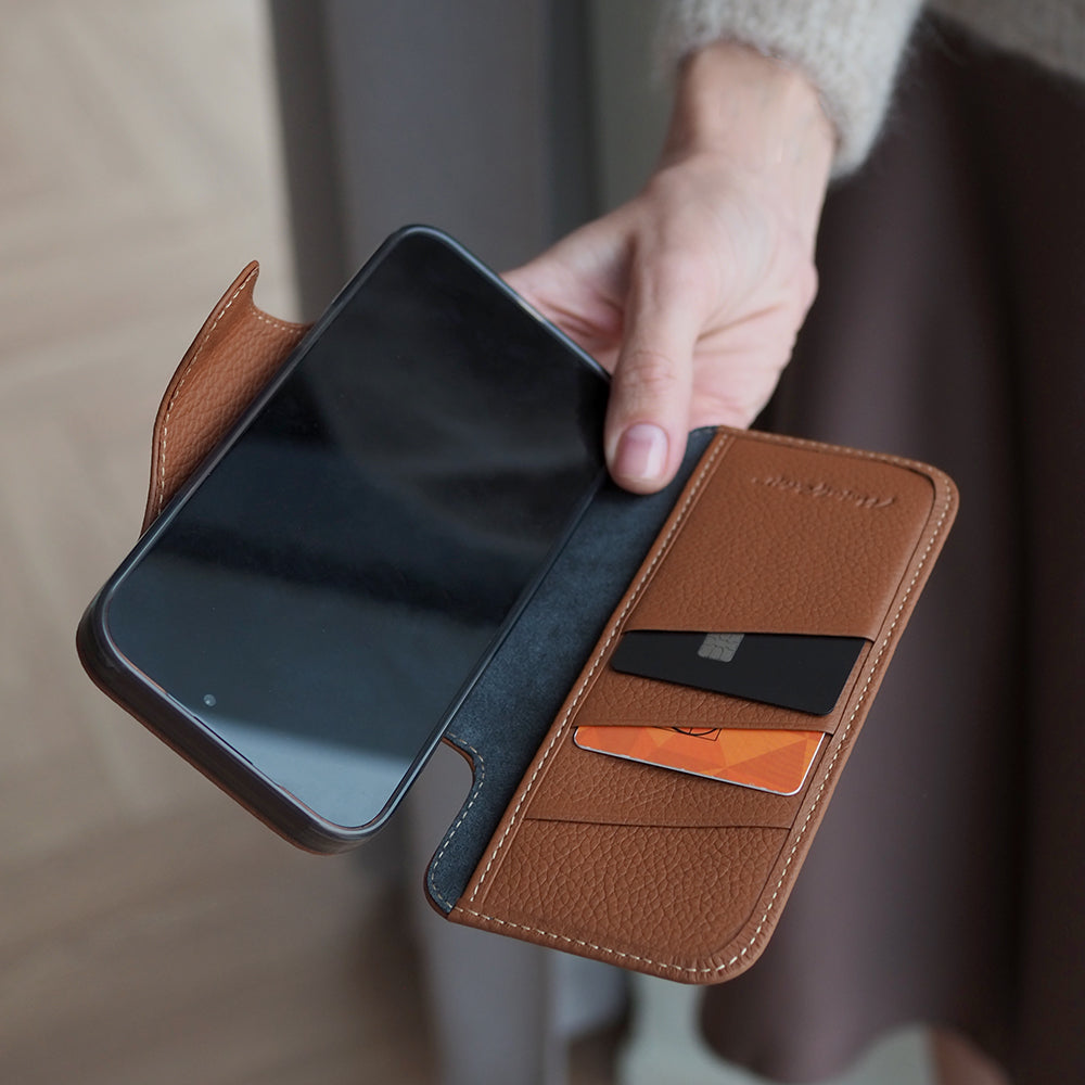 Gold Calfskin Wallet Case iPhone 17 Pro 3 cardholder slots - in hand with cards inside