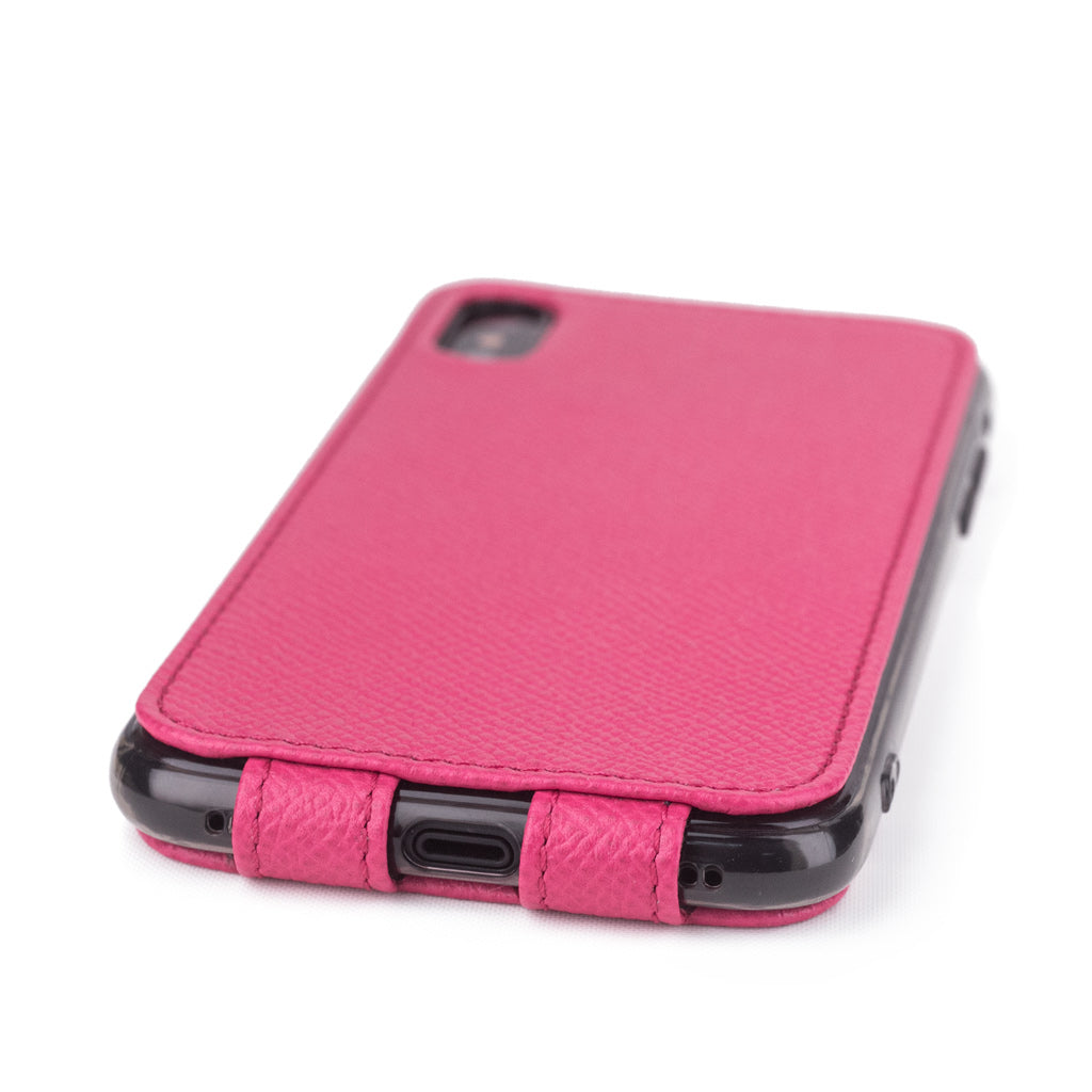 Pink Fluo leather flip case for iPhone X - close-up of the bottom edge showing the Lightning port opening