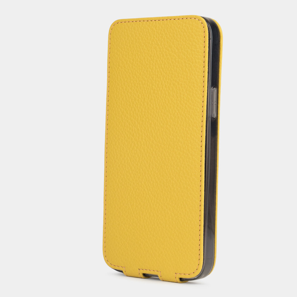 Yellow calfskin leather flip case for iPhone 15 – flap closed flat, profile view with side buttons accessible