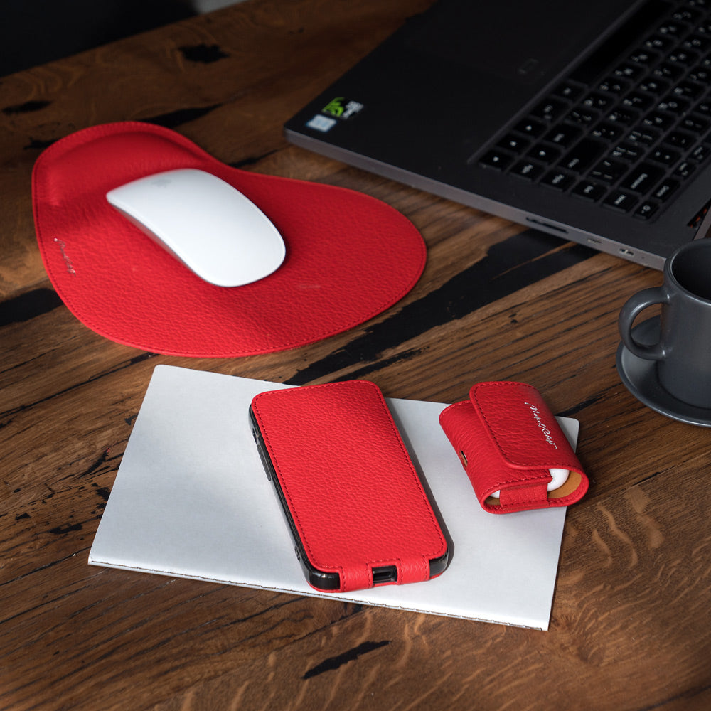 iPhone 14 Pro Max flip case made with red premium leather – lifestyle photo: the case with matching Marcel Robert leather desk accessories