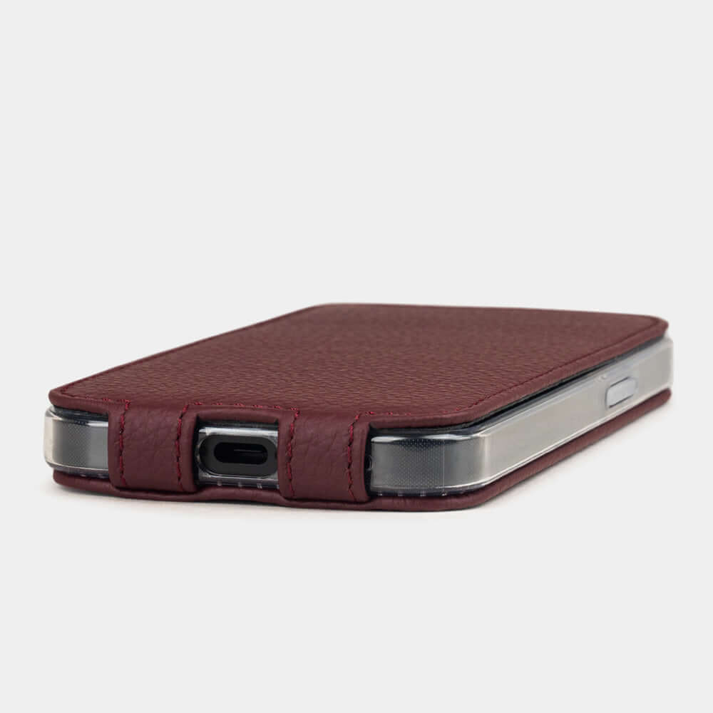 Bordeaux Calfskin Case iPhone 16 e - flat side view displaying ultra-thin handcrafted design, USB-C port opening and precise edge finishing