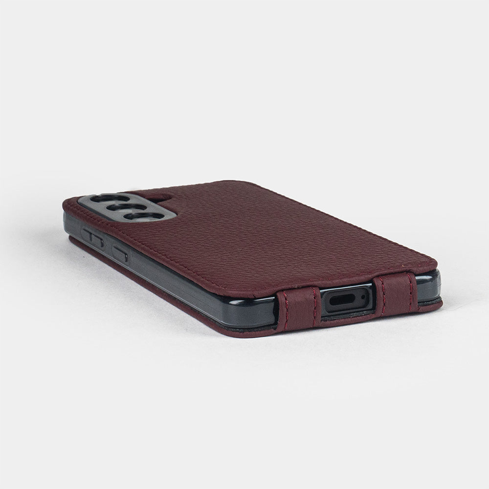 bordeaux calfskin flip case Samsung Galaxy S26 & S26 Plus - flat side view displaying ultra-thin handcrafted design, USB-C port opening and precise edge finishing