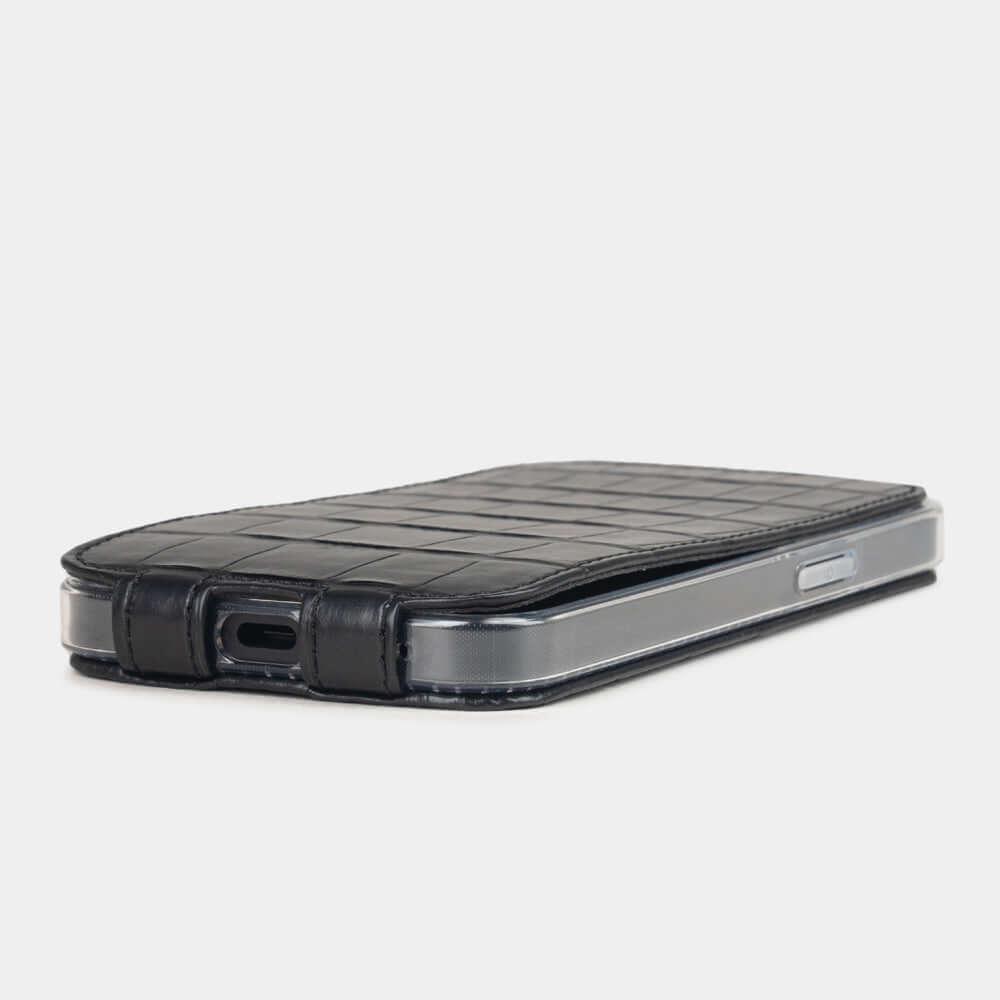 Black Alligator Case iPhone 16 e - flat side view displaying ultra-thin handcrafted design, USB-C port opening and precise edge finishing