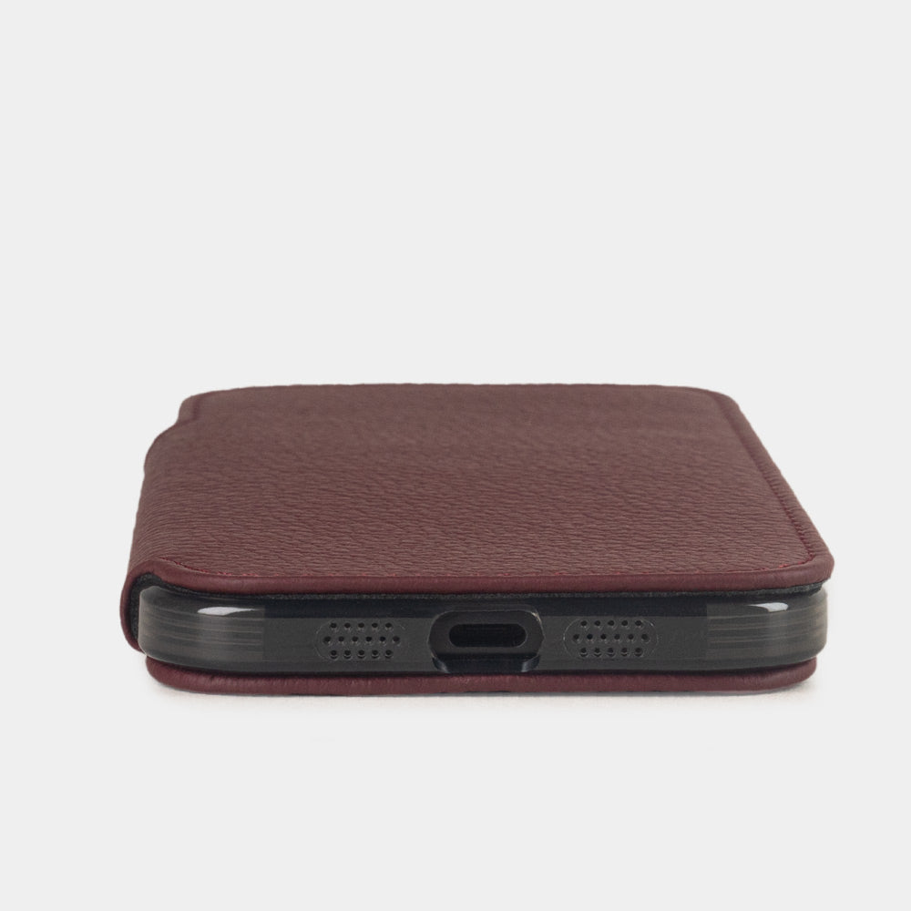 iPhone 17e & 16e calfskin folio wallet case bordeaux – flat view showing the slimness of the design, the USB-C port opening and a luxurious edge finish