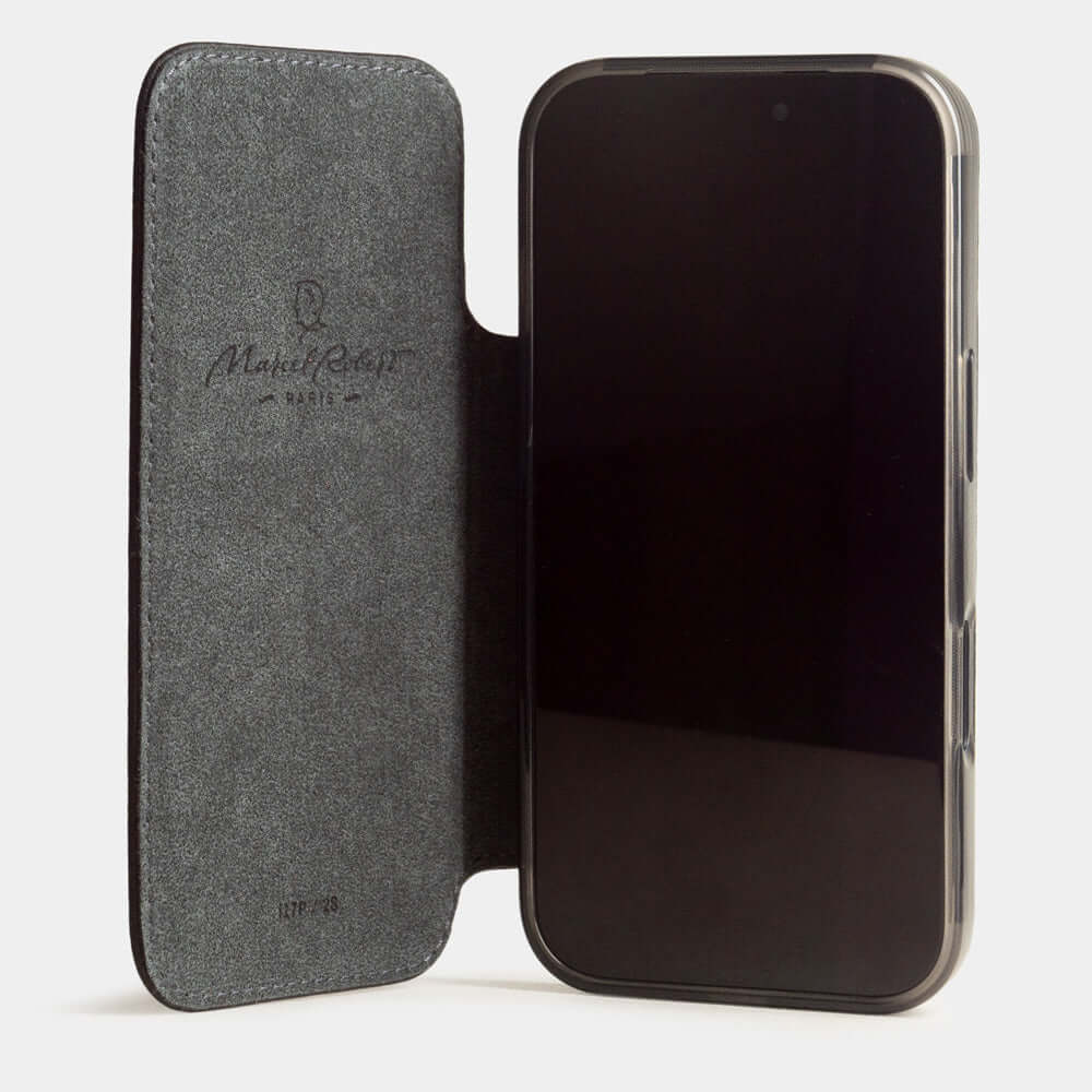 Black Calfskin Wallet Case iPhone 17 - case with grey Alcantara lining shown open on smartphone