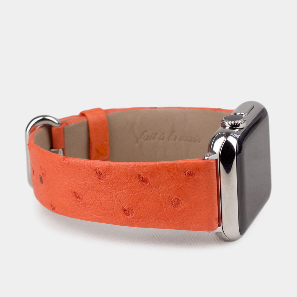 Strap for the Apple Watch 41/42 mm in orange ostrich leather, with steel adapters and buckle | 3/4 profile view to see the inner lining leather