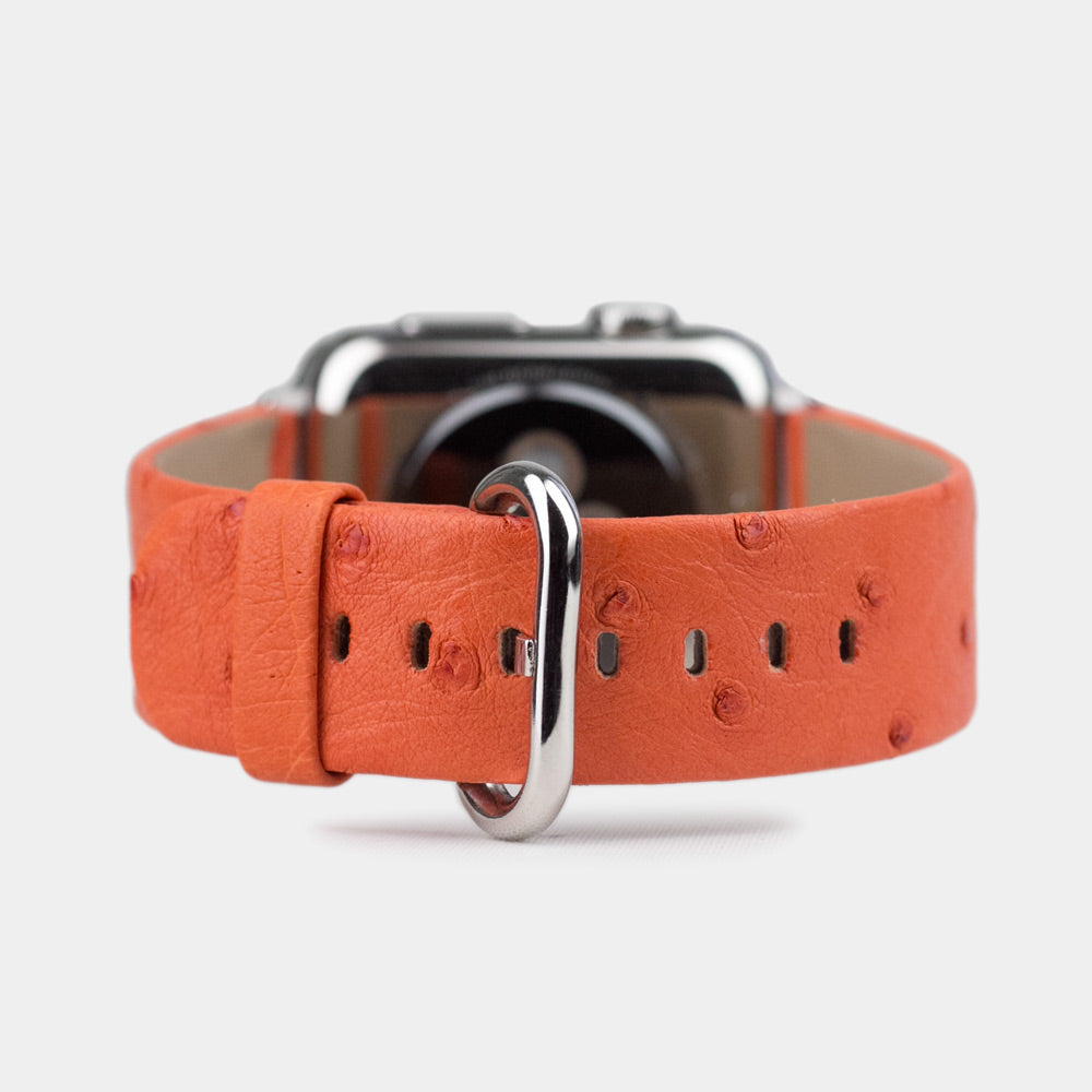 Strap for the Apple Watch 41/42 mm in orange ostrich leather, with steel adapters and buckle | front view of the strap looped around the watch case