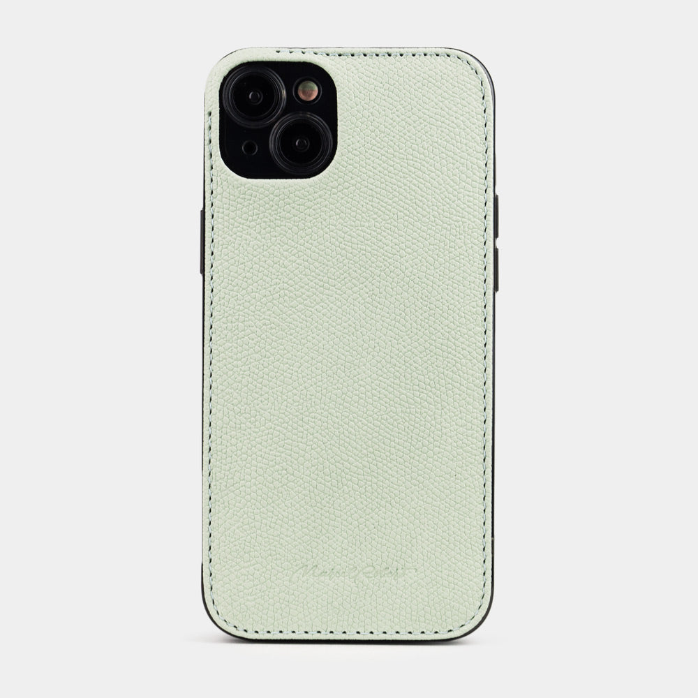 Coque cuir vert pastel pour iPhone 15 Plus – vue de dos côté appareil photo, rebord de cuir surélevé protégeant les objectifs