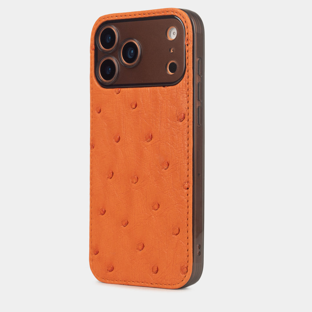 iPhone 17 Pro & Pro Max cover case in orange ostrich leather – three-quarter back view on an orange iPhone
