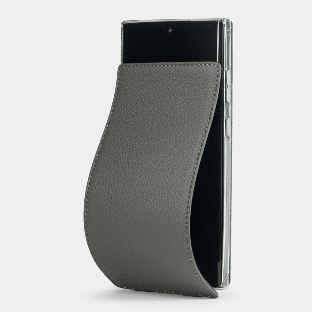 Funda de piel flip Samsung S23 Ultra gris, solapa magnética abriéndose para revelar la pantalla