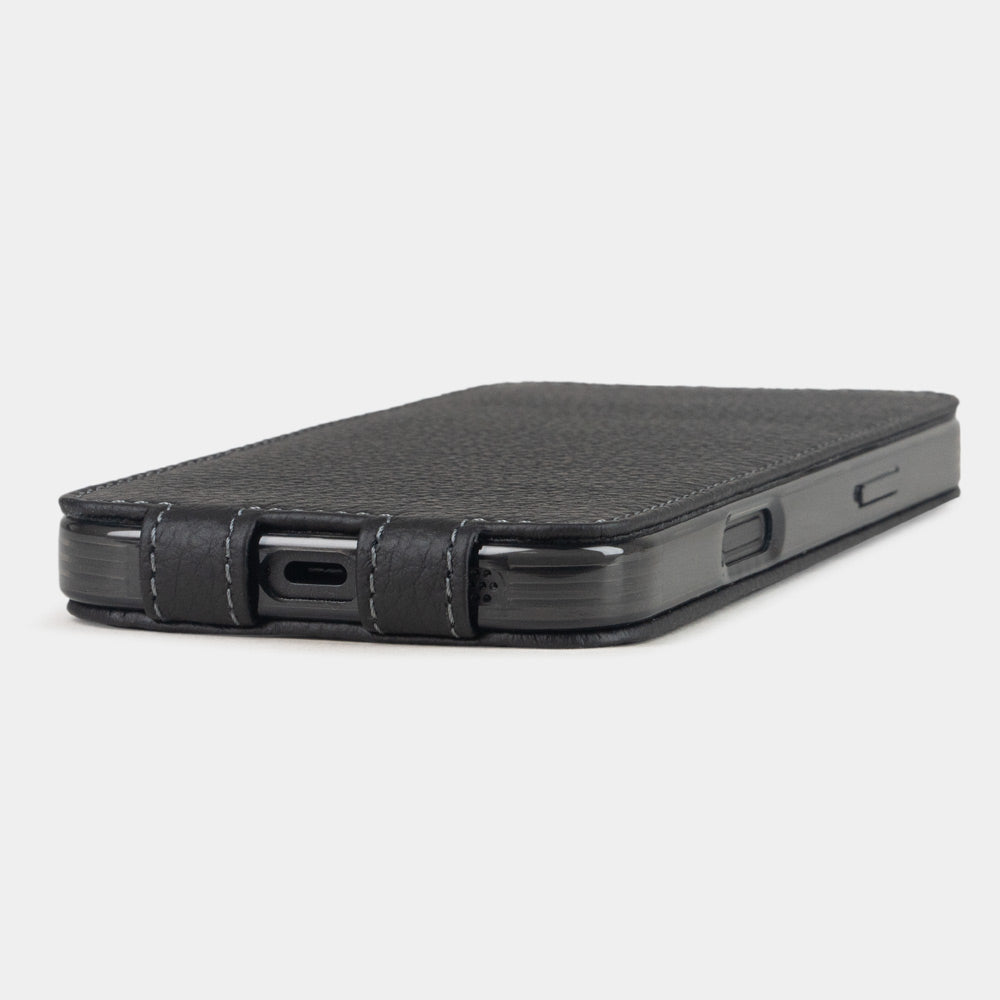 black leather flip case iPhone 17 - flat side view displaying ultra-thin handcrafted design, USB-C port opening and precise edge finishing