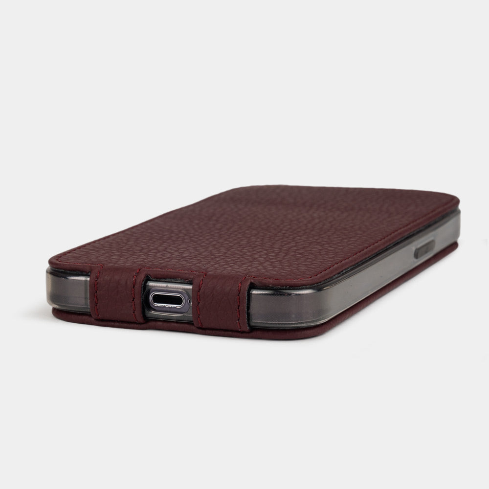 iPhone 14 Pro Max flip case made with bordeaux premium leather – the case laid flat, showing the precise charging-port cut-out and how slim it stays