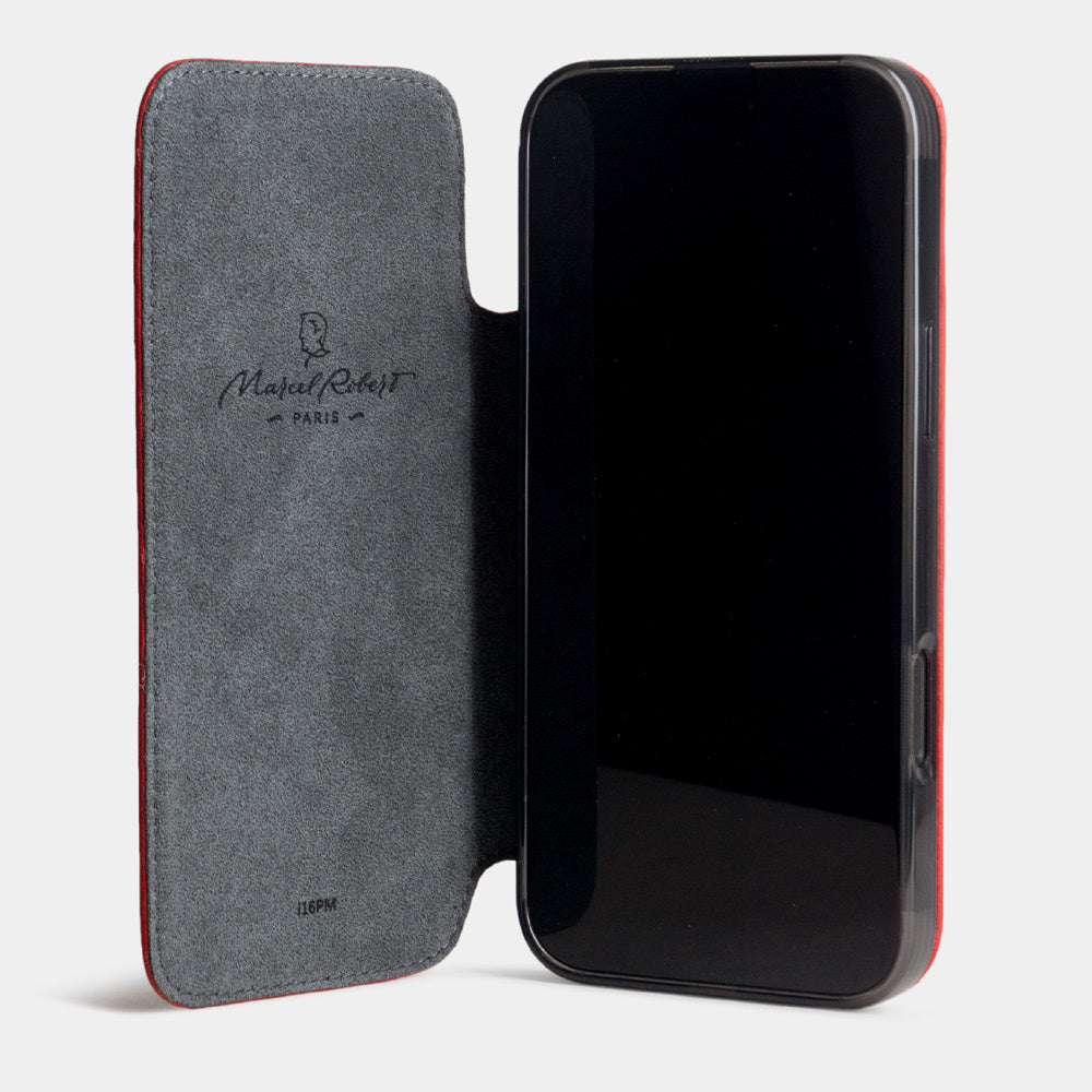 Open folio view of Marcel Robert iPhone 17 folio case in red calfskin leather, grey Alcantara cover folded back and held with integrated magnets