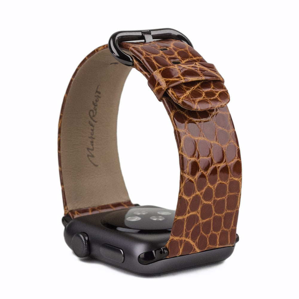 gold alligator strap apple watch black adapters and buckle upper view