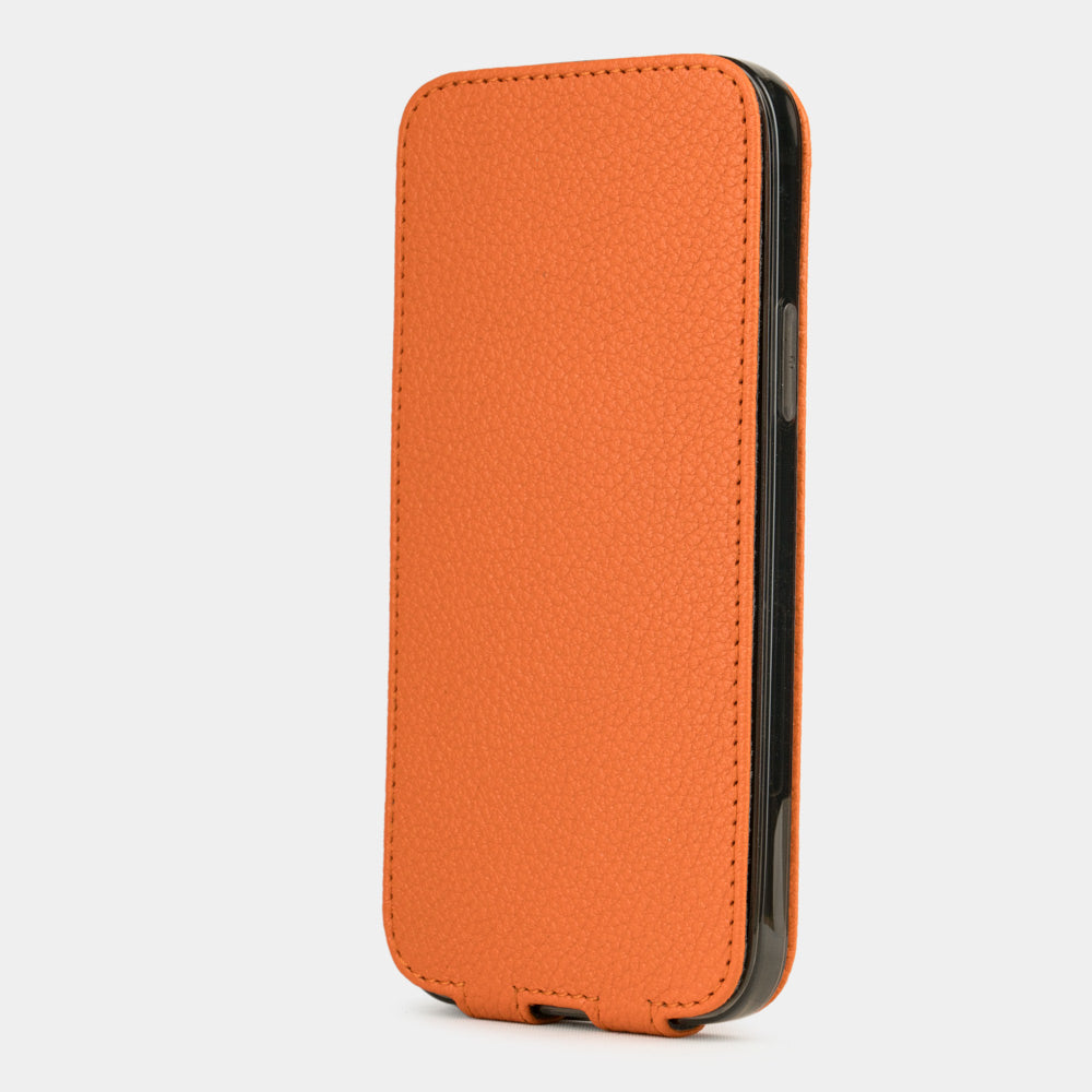 orange leather iPhone 12 pro max flip case in an upright position, cover closes securely thanks to its integrated magnet system