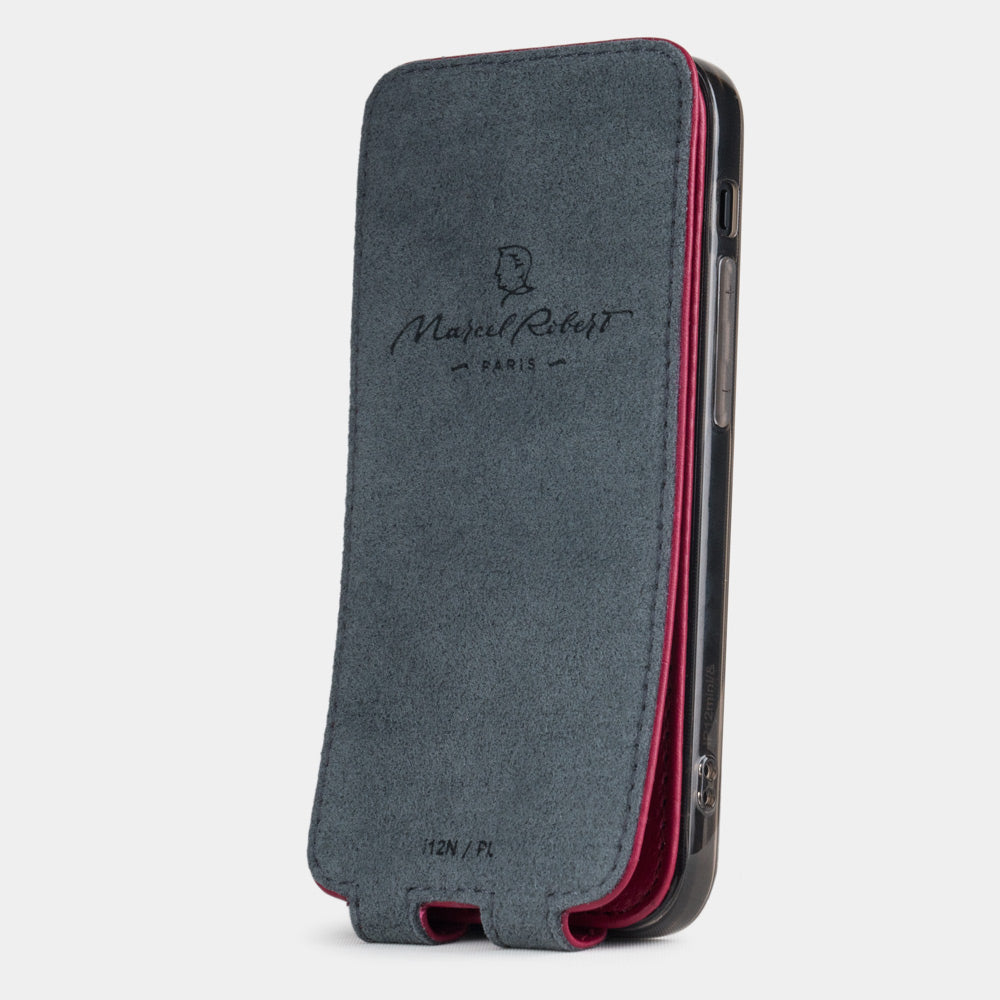 pink fushia leather flip case for iPhone 12 pro max, vertical position, cover folded and secured to the back of the iPhone thanks to its integrated magnet system, revealing the grey microfiber lining