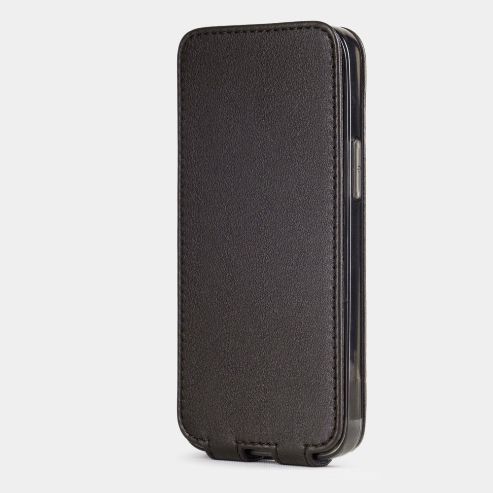 brown leather iPhone 12 Pro flip case in an upright position, cover closes securely thanks to its integrated magnet system