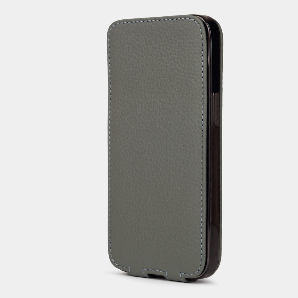 Grey calfskin leather flip case for iPhone 15 – flap closed flat, profile view with side buttons accessible