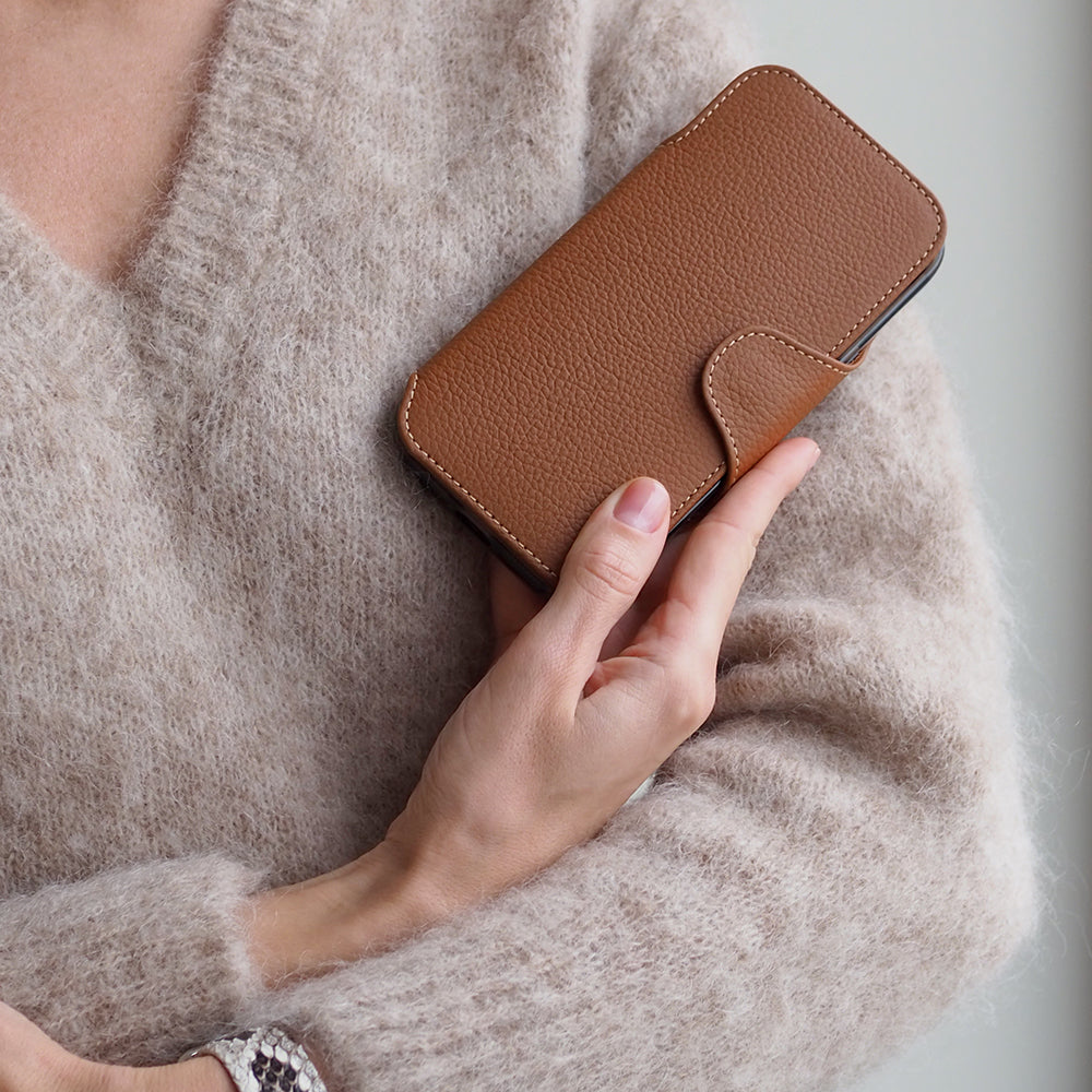 Gold Calfskin Wallet Case iPhone 17 Pro 3 cardholder slots - closed in woman's hand 