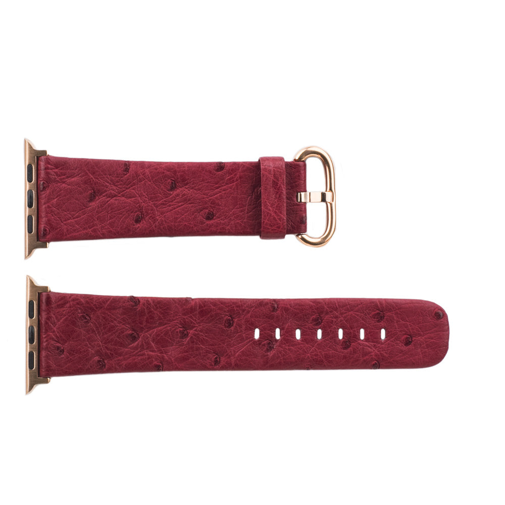 Strap for the Apple Watch 41/42 mm in fuchsia ostrich leather, with pink gold adapters and buckle | flat lay view of the full strap to see its length