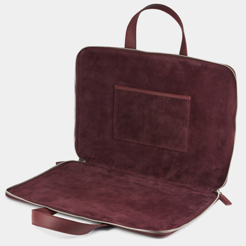 Women’s slim 17 inch bordeaux leather laptop bag open showing laptop compartment and suede lining