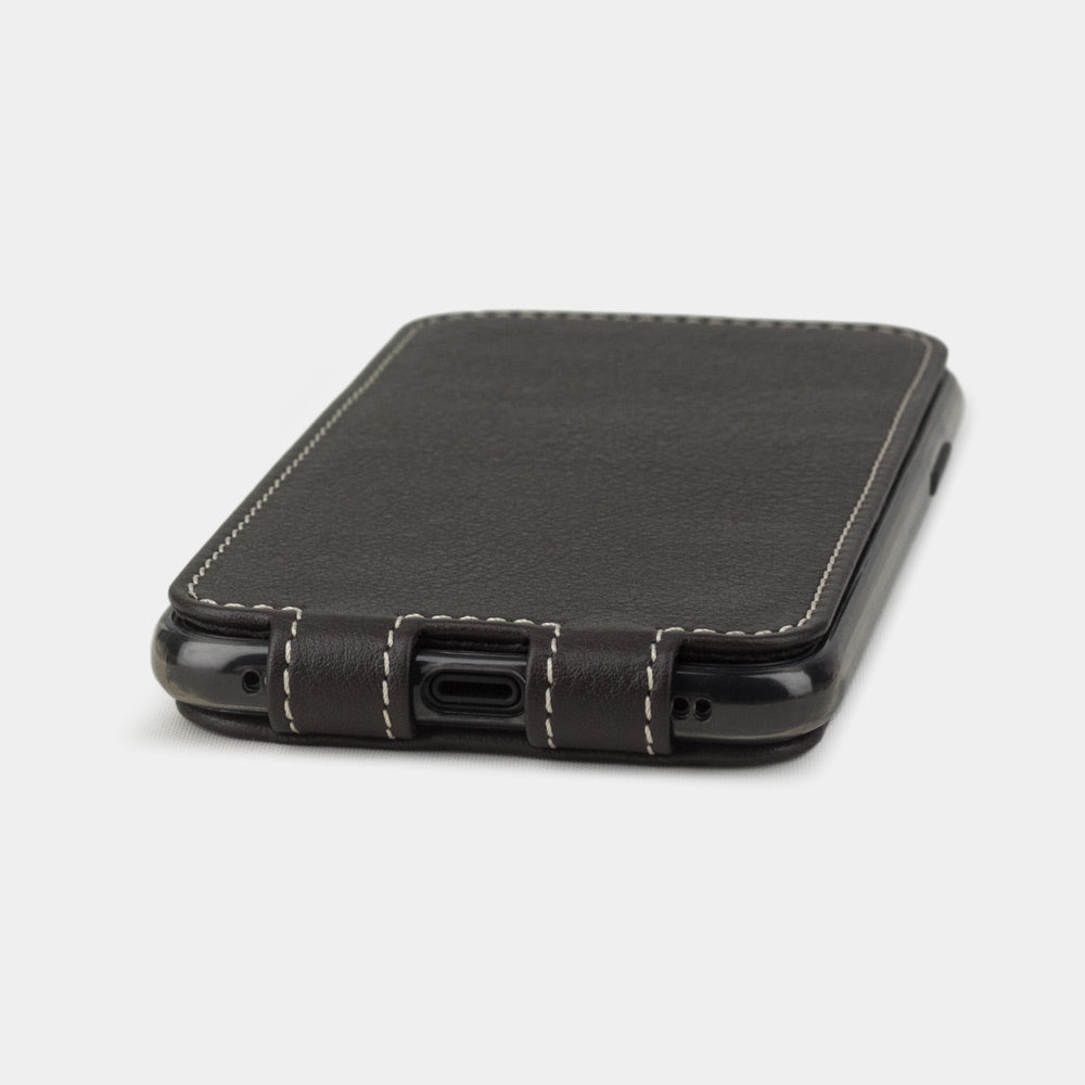 Brown leather case for iPhone X - close-up of the bottom edge showing the Lightning port opening