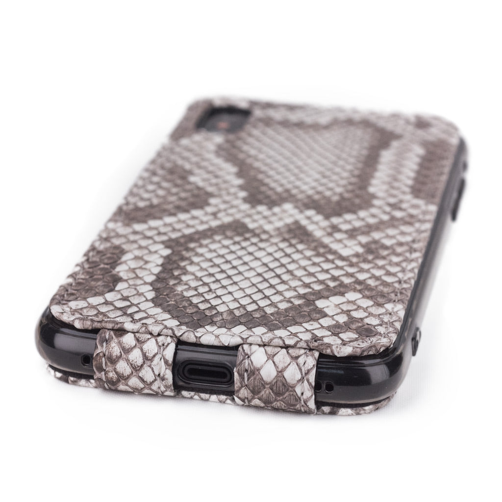 Natural python leather flip case for iPhone XS Max - close-up of the bottom edge showing the Lightning port opening
