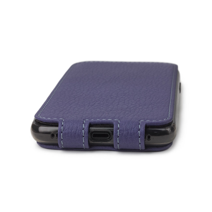 Purple leather flip case for iPhone X - close-up of the bottom edge showing the Lightning port opening