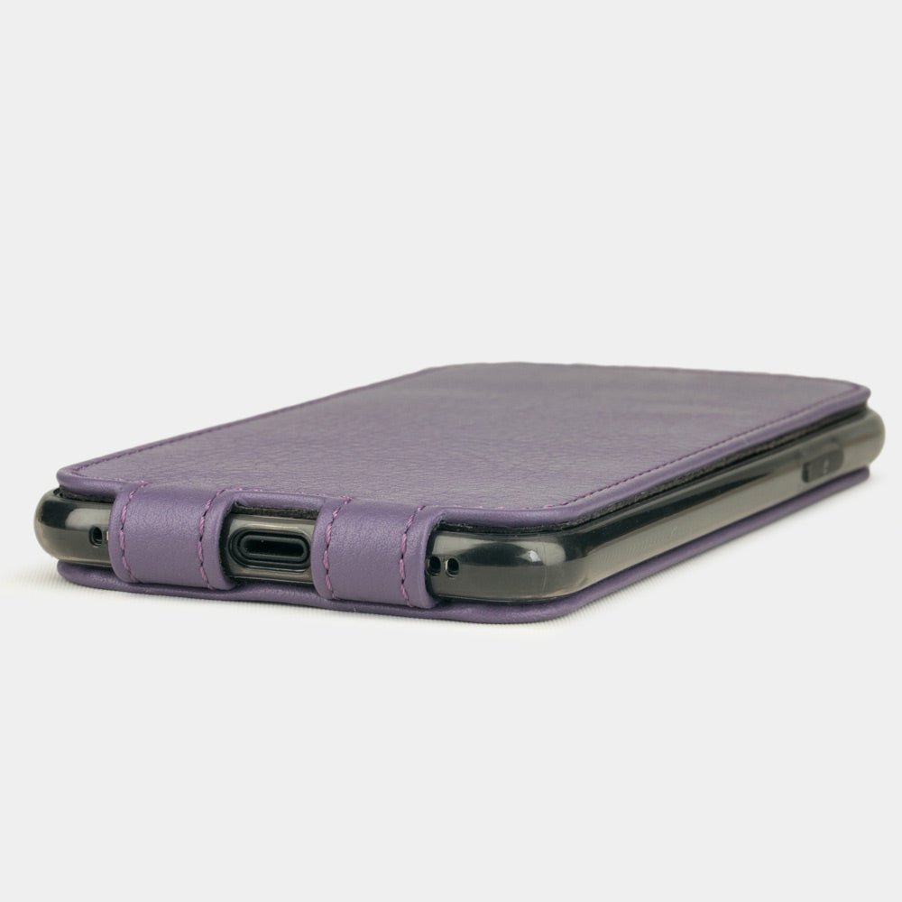Violet leather flip case for iPhone X - close-up of the bottom edge showing the Lightning port opening