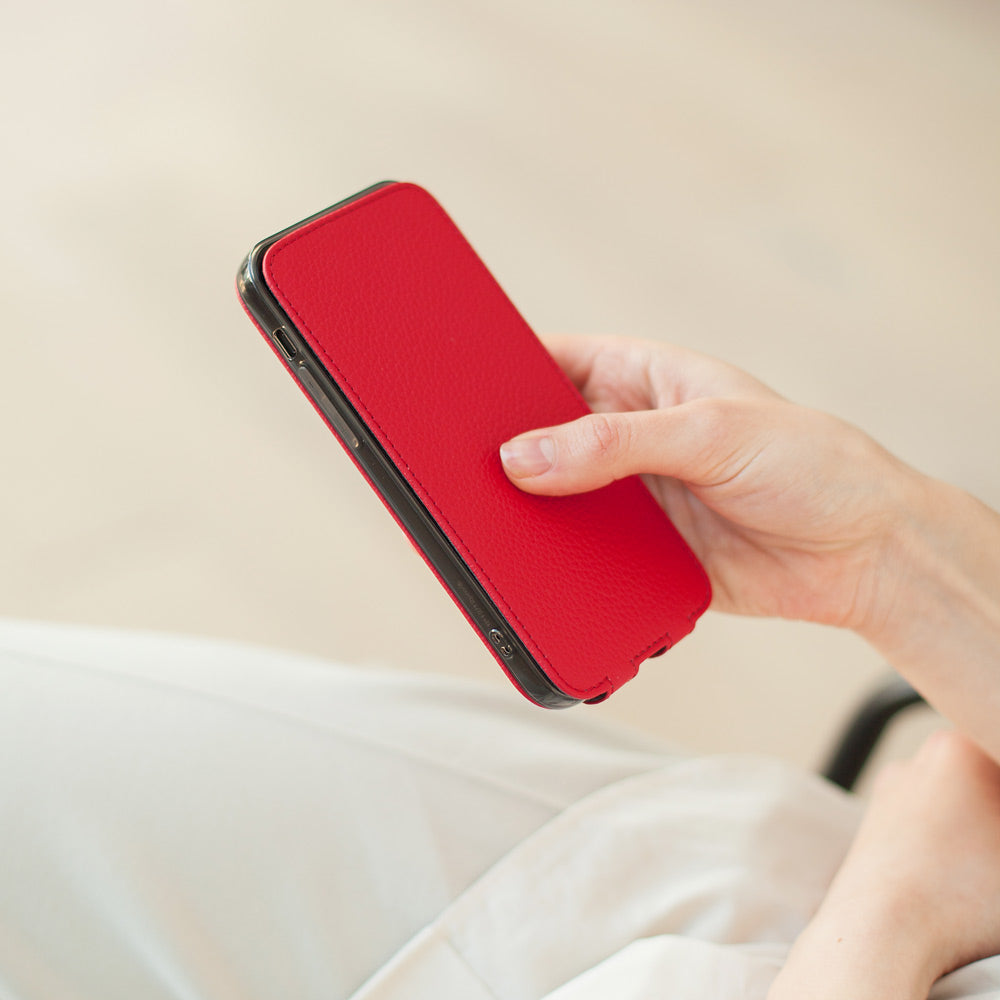 red Calfskin Case iPhone 15 Pro & Pro Max – upright closed view highlighting the magnetic front cover fully protecting the screen, elegant silhouette